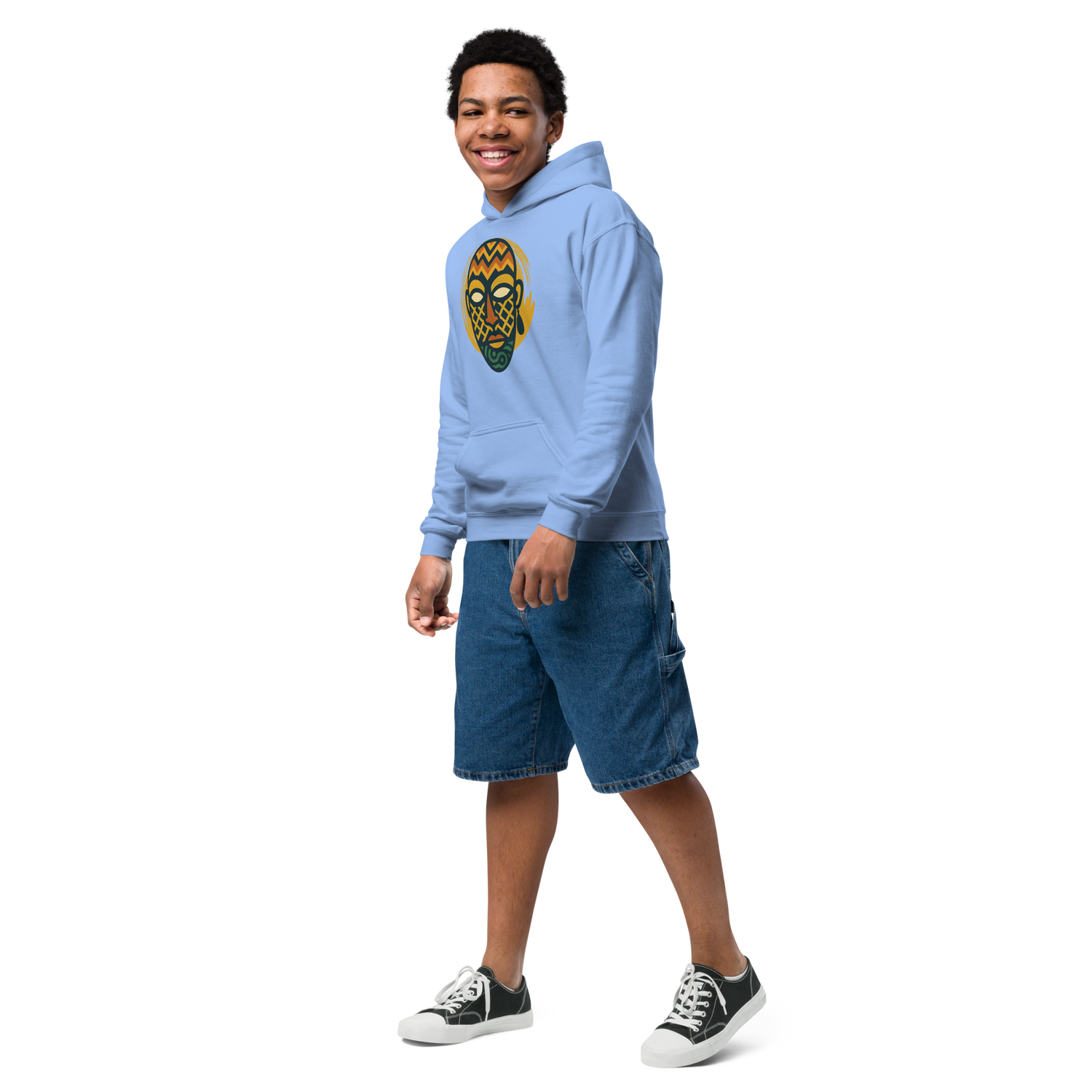 Boy wearing a blue hoodie with an artistic mask design for the winter collection hoodies and jackets.